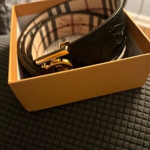 XL Men or women’s reversible belt black/multi with gold buckle.  New with box